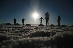 Watch the sun rise inside the Uyuni salt flat.